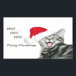 Sticker Rectangulaire Merry Christmas chaton<br><div class="desc">Un chaton tabby en argent dans un chapeau de Père Noël avec sa bouche ouverte donnant un Ho ho joyeux,  Joyeux Noël saluant autocollant rectangulaire. Le texte peut être facilement changé ou supprimé,  le chaton peut être repositionné.</div>