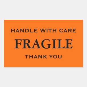 Sticker Rectangulaire Orange/Noir Fragile. Manipulez avec soin. Merci.