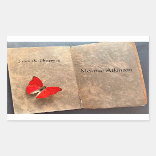 Sticker Rectangulaire Papillon rouge sur les pages vintages du livre