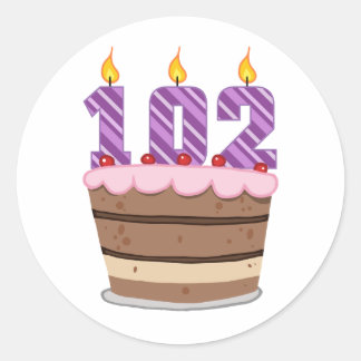 Sticker Rond 102 ans sur le gâteau d'anniversaire