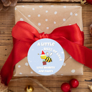 Sticker Rond Abeille de Noël portant le chapeau du Père Noël En