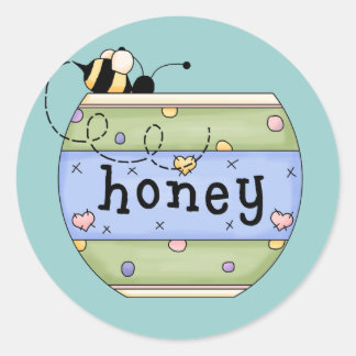 Sticker Rond Abeille volant dans un pot de miel