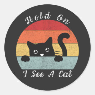 Sticker Rond Accrochez-vous Je vois un chat, un chat jouant et