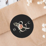 Sticker Rond Ampersand floral élégant mariage Monogramme noir<br><div class="desc">Élégant autocollant de mariage dispose d'une esperluette ornée de fleurs aquarellées en blanc,  vert et terre cuite,  avec vos initiales. Pour une personnalisation plus avancée de cette conception,  cliquez sur le BOUTON OUTIL DESIGN BLEU ci-dessus ! Des articles correspondants sont également disponibles.</div>