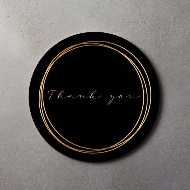Sticker Rond Anneaux noirs et dorés Merci Élégance moderne (Black round thank you sticker with gold script and double circle frame)