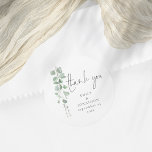 Sticker Rond Aquarelle Eucalyptus Noms Date Merci Mariage<br><div class="desc">Aquarelle Eucalyptus Noms Date Merci Mariage. D'élégants feuilles d'eucalyptus à l'aquarelle descendent du côté supérieur gauche. Des personnages faciles mentent vos noms et date de mariage.</div>