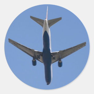 Sticker Rond Avion simple sur l'arrière - plan bleu ciel
