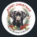 Sticker Rond Black Labrador Retriever Dog Christmas Wreath<br><div class="desc">Ces jolis stickers Holiday présentent un beau portrait aquarelle d'un Labrador Retriever noir. Le chien est encadré d'une toux de pin,  de sainte et de fraises rouges. Votre texte personnalisé est en rouge et noir au-dessus et au-dessous de l'image. Idéal pour votre correspondance de Noël ou forfaits cadeaux.</div>
