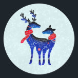 Sticker Rond Blue Nordic Christmas Reindeer Pair<br><div class="desc">Un autocollant avec un arrière - plan vert clair et blanc à l'allure enneigée. Illustré par une paire de cerfs bleus scandinaves portant des foulards rouges. Avec des marquages décoratifs sur le corps.</div>