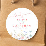 Sticker Rond Boho aquarelle fleur sauvage mariage<br><div class="desc">Elégant simple printemps été rustique floral botanique aquarelle bohême jardin blanc merci mariage autocollant modèle avec des fleurs sauvages colorés et un script de calligraphie rose chic.                      Facile à personnaliser avec votre texte,  vos noms et votre date !                 Convient pour les mariages bohèmes de campagne en plein air rustique.</div>