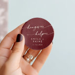 Sticker Rond Boho Chic Bourgogne Rouge Hangover Aide Favoriser<br><div class="desc">Ce boho chic rouge gueule-de-gueule de bois favorise un autocollant rond classique est parfait pour un mariage minimaliste. Le vin de marron foncé rouge design bohème moderne dispose de calligraphie rustique simple avec un style unique mais classique. Personnalisez vos autocollants de faveur avec vos noms et votre date de mariage....</div>