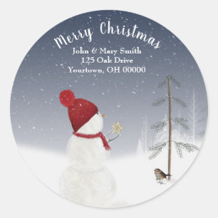 Sticker Rond bonhomme de neige de Noël sous des flocons de neig