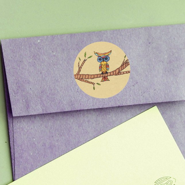 Sticker Rond Branche de chouette colorée (Fantasy owl colourful feathers blue eyes on branch with leaves on tan round stickers.)