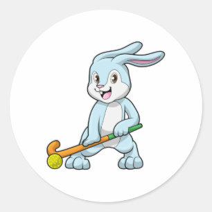 Sticker Rond Bunny au hockey sur gazon avec bâton de hockey