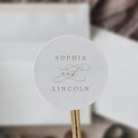 Sticker Rond Calligraphie d'or romantique Mariage Enveloppe Pho<br><div class="desc">Ces enveloppes romantiques de mariage de calligraphie d'or sont parfaites pour un simple mariage. Le design classique moderne comprend des tourbillons fantaisistes et des fleurs fantaisistes avec une magnifique typographie de feuille d'or en faux champagne. Personnalisez le étiquette avec les noms de la mariée et du marié. Remarque : Ce...</div>