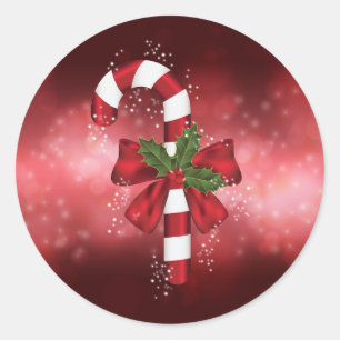 Sticker Rond Canne de bonbons rouge sur un fond bokeh rouge