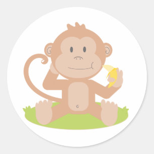 Sticker Rond Caricature mignonne Singe assis et manger Banane