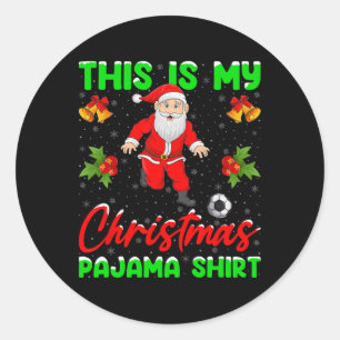 Sticker Rond C'est mon pyjama de Noël Santa jouant au football