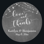 Sticker Rond Chalkboard Lights Mariage Script Love and Thanks<br><div class="desc">Avec un arrière - plan de tableau noir texturé et deux cordes d'accents lumineux blanc scintillants, j'ai combiné une police de script élaborée et moderne pour rendre des graphiques représentant des mots clés et des phrases dans cette collection sur le thème du mariage. Dans cet autocollant, la calligraphie dit "amour...</div>