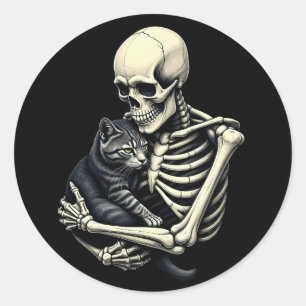 Sticker Rond Chat drôle de Halloween qui étreint un squelette p