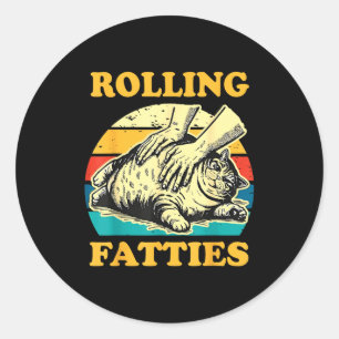 Sticker Rond Chat qui fait rouler des grosses boules drôle pour