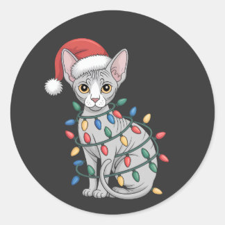 Sticker Rond Chat Sphynx portant un chapeau de Père Noël et env