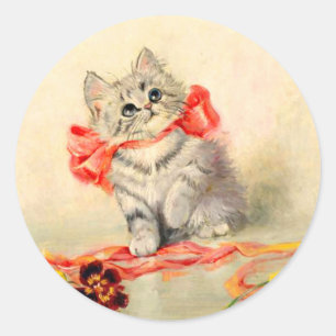 Sticker Rond Chaton au ruban rouge