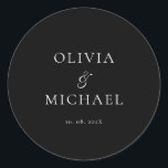 Sticker Rond Chic Script Black Minimalist Wedding<br><div class="desc">Add a personal and elegant touch to your wedding favors, envelopes, or packaging with this minimalist round sticker featuring your custom name in a graceful script font. Designed to complement a modern and timeless wedding theme, this classic black-and-white design pairs beautifully with any part of your celebration. Perfect for sealing...</div>