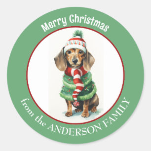 Sticker Rond Chien Brown Dachshund en vêtements d'hiver Noël