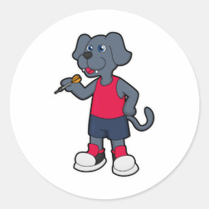 Sticker Rond Chien comme joueur de fléchettes avec fléchettes