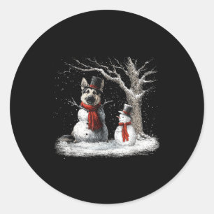 Sticker Rond Chien de berger allemand drôle dans l'arbre enneig