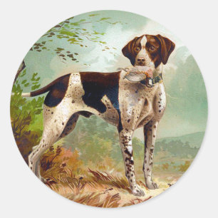 Sticker Rond Chien de chasse avec oiseau dans la bouche