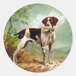 Sticker Rond Chien de chasse avec oiseau dans la bouche