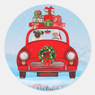 Sticker Rond Chien Pug dans une voiture avec le Père Noël