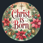 Sticker Rond Christ Est Né Noël Poinsettia Religieux<br><div class="desc">Célébrez la naissance du Christ avec cet élégant autocollant de Noël de style vintage. Doté de poinsettias rouges vibrantes entourant le message joliment écrit "CHRIST IS BORN",  cet autocollant évoque la chaleur et la joie de la saison. T</div>