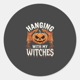 Sticker Rond Citrouille d'Halloween avec mes sorcières pendues
