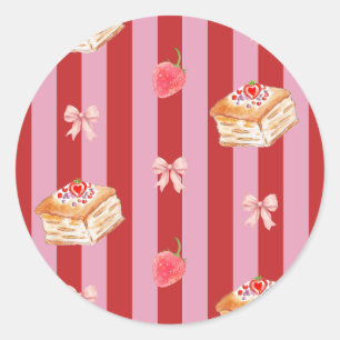 Sticker Rond Conception rayée rose et rouge avec motif de gâtea