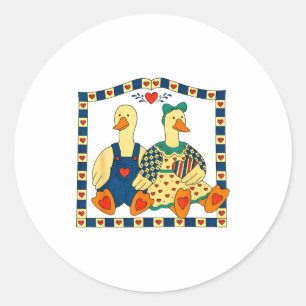 Sticker Rond Couple de canards d'art populaire avec des cœurs d