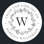 Sticker Rond Couronne florale monogramme de la bibliothèque<br><div class="desc">Ajoutez une touche élégante à tous vos livres préférés grâce à notre chic Monogramme Floral Wreath From the Library of Bookplate, avec votre monogramme initial unique en lettres serif classiques, encadré par une couronne de fleurs, de bourgeons et de minuscules feuilles botaniques dessinés à la main. "De la bibliothèque de"...</div>