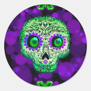 Sticker Rond Crâne de sucre vert et violet lumineux pour la fêt