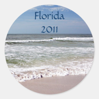 Sticker Rond Crash des vagues sur la plage de sable