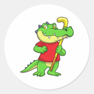 Sticker Rond Crocodile au hockey sur gazon avec bâton de hockey