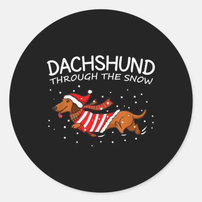 Sticker Rond Dachshund à travers la neige drôle chien Noël (Devant)