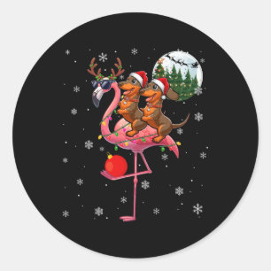 Sticker Rond Deux Dachshunds de Noël chevauchant des rennes fla