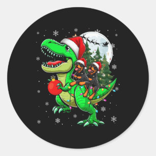 Sticker Rond Deux Rottweilers de Noël à cheval T-rex Reindeer L