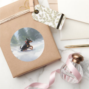 Sticker Rond Doberman Pinscher neige de Noël hiver