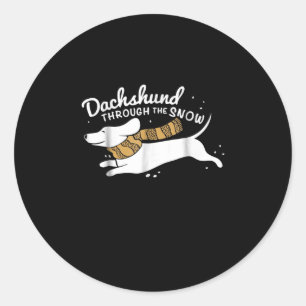 Sticker Rond Don de chien Dachshund À Travers La Neige