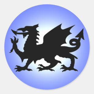 Sticker Rond Dragon de Galles à ailes noires contre ciel bleu S