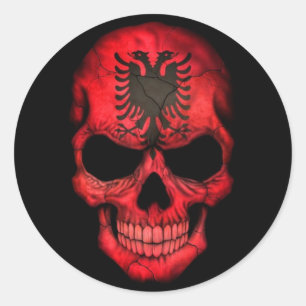 Sticker Rond Drapeau albanais sur noir