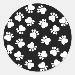 Sticker Rond Empreintes de pattes noirs et blancs d'amusement